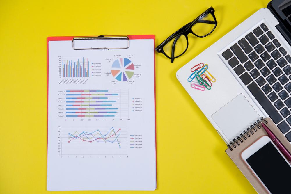A marketing report with traffic charts open on a desk